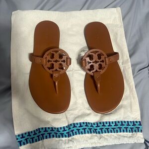 Brown Tory Burch sandals.